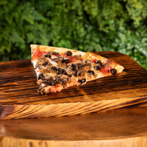 Slice of pizza on wood tray