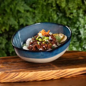 Korean BBW Beef in ceramic bowl on wood tray